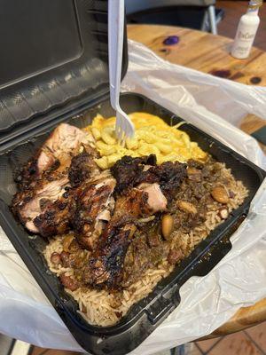 Jerk chicken, rice and peas and macaroni and cheese