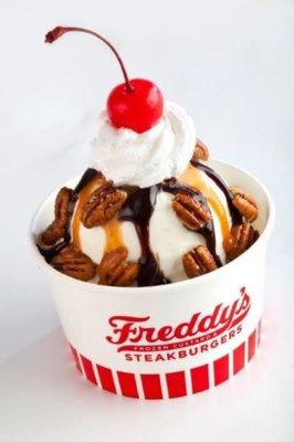 Cup of Frozen Custard with Pecans, Chocolate Syrup, Caramel Syrup, Whipped Cream, and Cherry on top