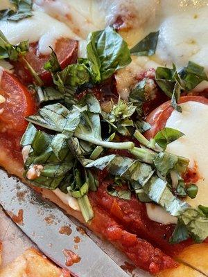 Who doesn't want the whole basil plant on their pizza?