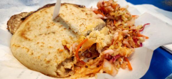 Pupusa with pork, bean, and cheese