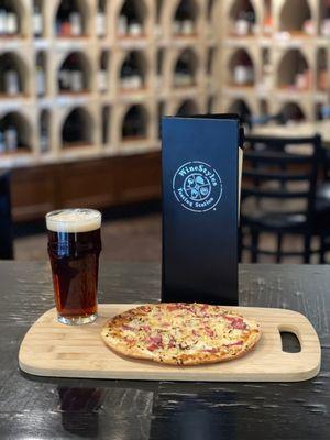 Snack on a pizzette and enjoy a glass of your favorite brew.