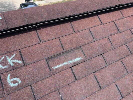 It's all over the roof just like this. Watch your contractors when they're on the roof or they will do this to your shingles