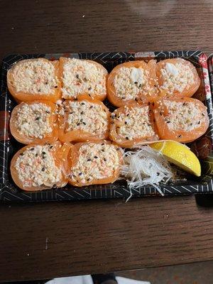 Fresh salmon wrapped around a spicy imitation crab mix.