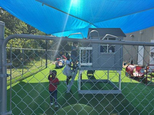 Kids are playing newly constructed play ground.