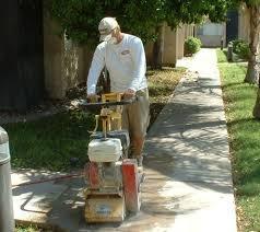 Scarufying sidewalk to remove trip hazard