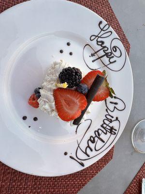 Birthday cake with happy birthday baked onto the plate, how thoughtful!