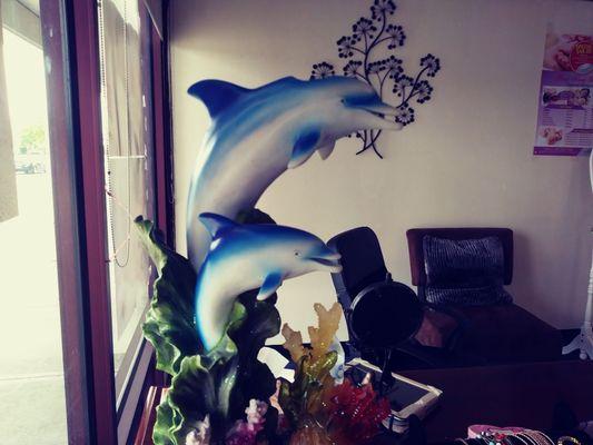 As you come inside Happy Feet Relaxing, you will notice our beautiful dolphins, by our reception desk.