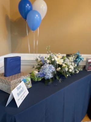 Gift table with balloons and florals