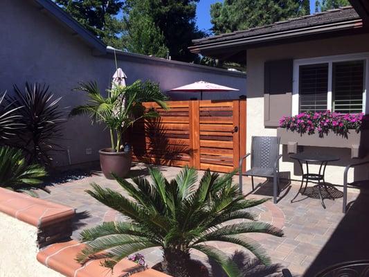 Hand stained Select Grade (no knots) mixed width Western Red Cedar Horizontal Fence and custom metal frame Gate / Lockset, Encinitas, Ca.