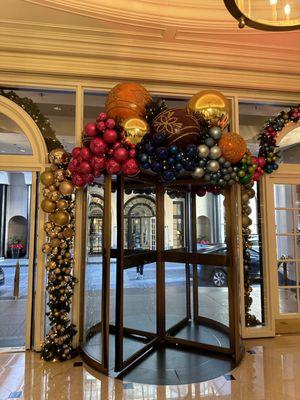 Holiday decor above the revolving door