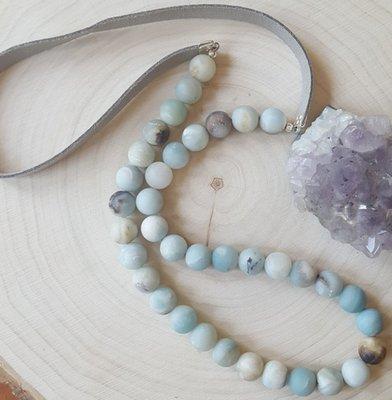 The most comfortable necklace you'll ever wear! The gray vegan suede is smooth and lightweight, with natural amazonite stones.