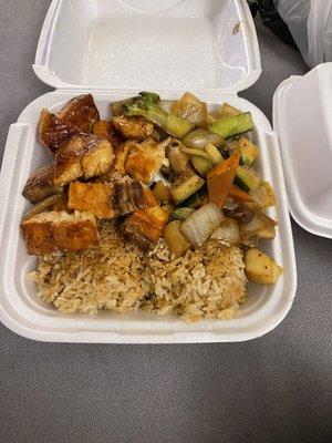 Salmon hibachi with fried rice and supposedly in this box my $6 side order of extra salmon is here as well