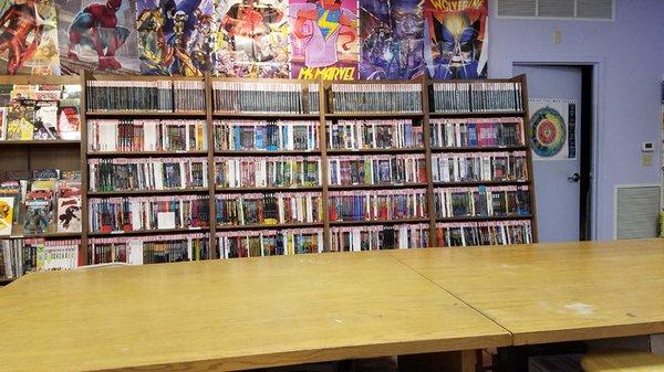 Graphic novels with long gaming table.