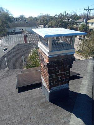 Galvanized chimney cap added to keep rain out.