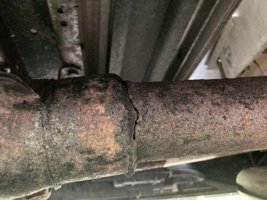 The crack in the exhaust line.