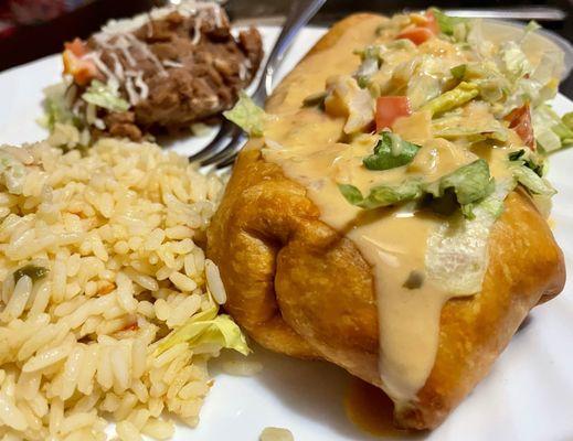 Chimichanga queso style with rice and beans