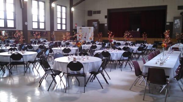 The auditorium set up for a wedding reception.