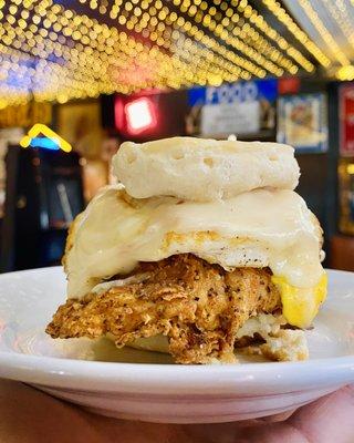 Momma's Fried Chicken Biscuit, topped with fried egg & cheese - available weekdays 6:30 a.m. to 11 a.m.