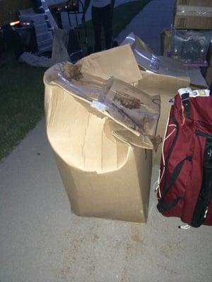 Two wardrobe boxes that arrived in this condition...also soaking wet...metal bar through top of boxes bent