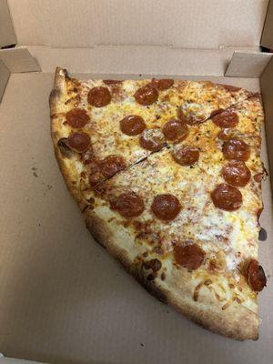 Note, this is a large to-go box, shown to give perspective on these hearty slices!