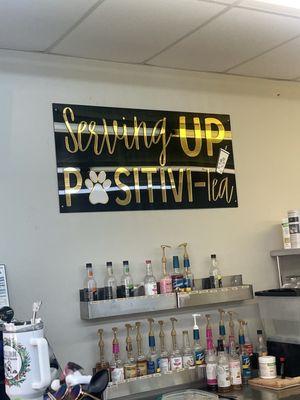 cute sign behind the counter