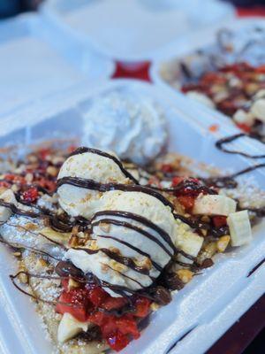 BNS banana, Nutella, strawberry, whipped cream, and powdered sugar.