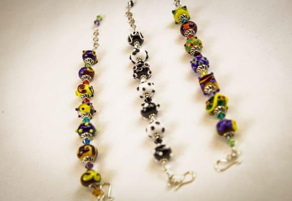 Beautiful hand made glass beads are found in store in multiple colors and hues.