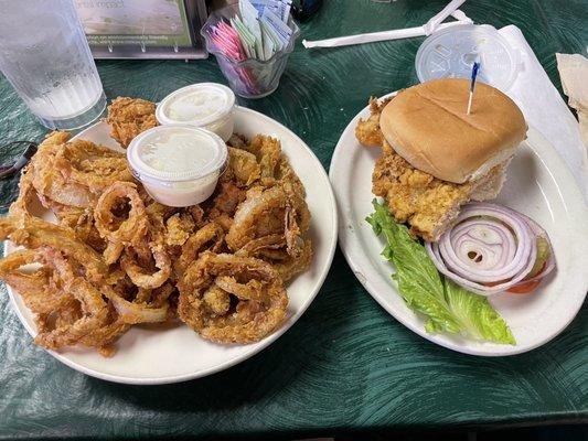 Half tenderloin sandwich and an appetizer of onion rings