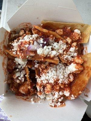 Without cilantro or sour cream. Just red onions, cheese, red sauce and asada. Love the packed chilaquiles!