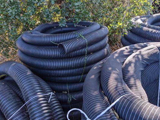 In stock: Corrugated, flexible, 3" and 4" solid and perforated, drainage pipe with and without a sock!