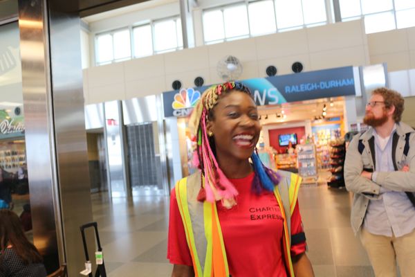 A customer and airport employee enjoying the wait.