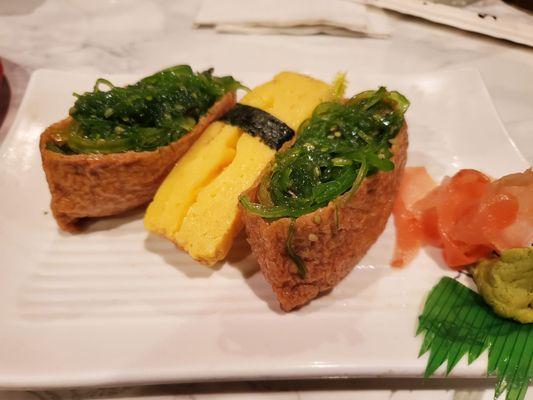 Inari came with seaweed salad, plus a "sweet egg" nigiri.