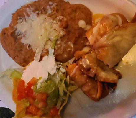 Beef tips Chimichanga with a side of refried beans