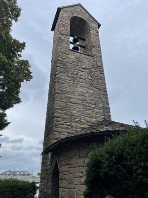 Bell tower of church in residental street adjacent to Eeel Pond