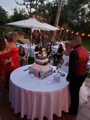 Cake table and umbrellas on the dance floor they provided.