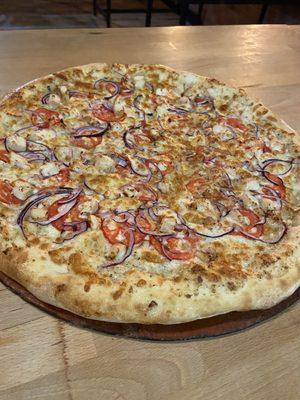 Our most popular pie, The Garlic Chicken; chicken, tomato, red onion and the soon-to-be-famous white sauce!