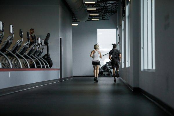 Indoor track and cardio deck with treadmills, stair-steppers, rowers, ellipticals, and eco-equipment!