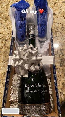 Custom engraved Champagne bottle and flutes. Perfect for a wedding or anniversary gift.