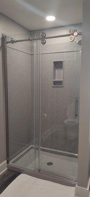 Very nice shower with auto closing door.  The shower has high pressure and very full!