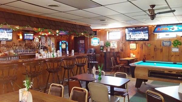 2 large screen tvs, AMI jukebox, large assortment of bottled beer and some drafts.