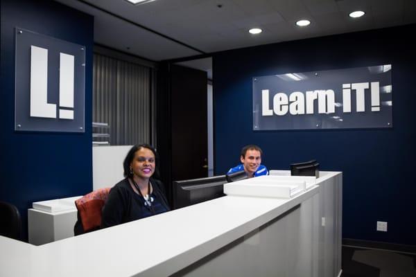 Julie and Ben at the Learn iT! front desk.