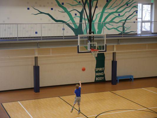 Our gymnasium is overlooked by the indoor running track and features a full-sized basketball court.