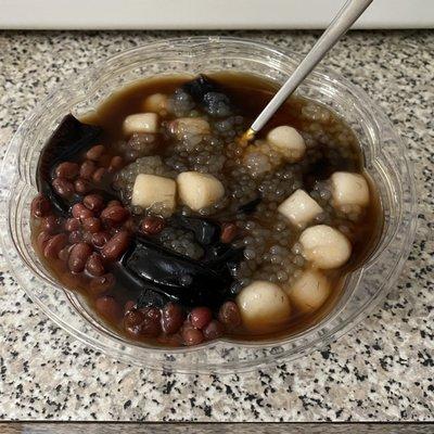 Herbal jelly dessert with taro mochi balls, red beans and sago