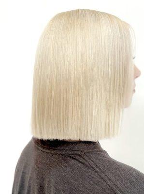 full coverage platinum color transformation with a shoulder length bob haircut