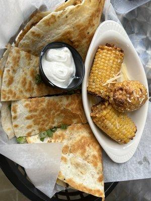 Spicy chicken quesadilla with side of fried corn