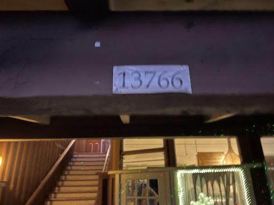 Address is hard to read, but it's in front of the stairs to the massage studio