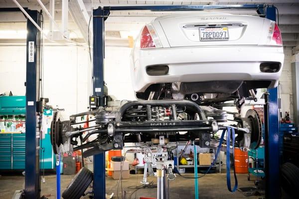 Taking the axle out of a Maserati.