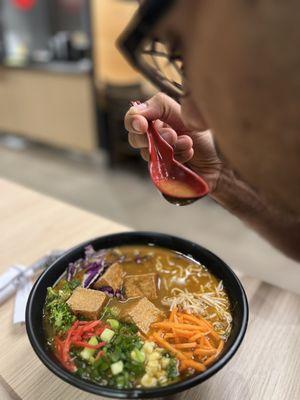 Vegetarian broth with traditional noodle tofu and toppings