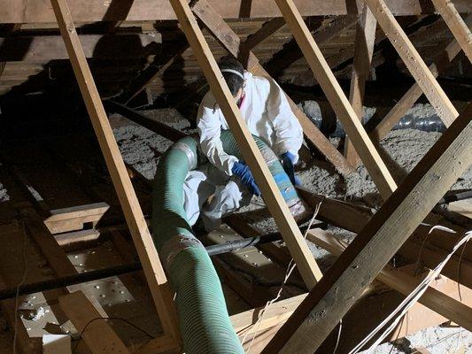 Attic blown insulation removal.