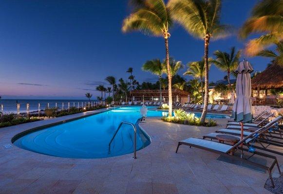 Spectacular night-time view of pool serviced by Reef Tropical Pools